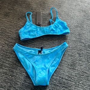 Rina ocean floral bikini by TRIANGL. Brand new never worn. Size is too small.